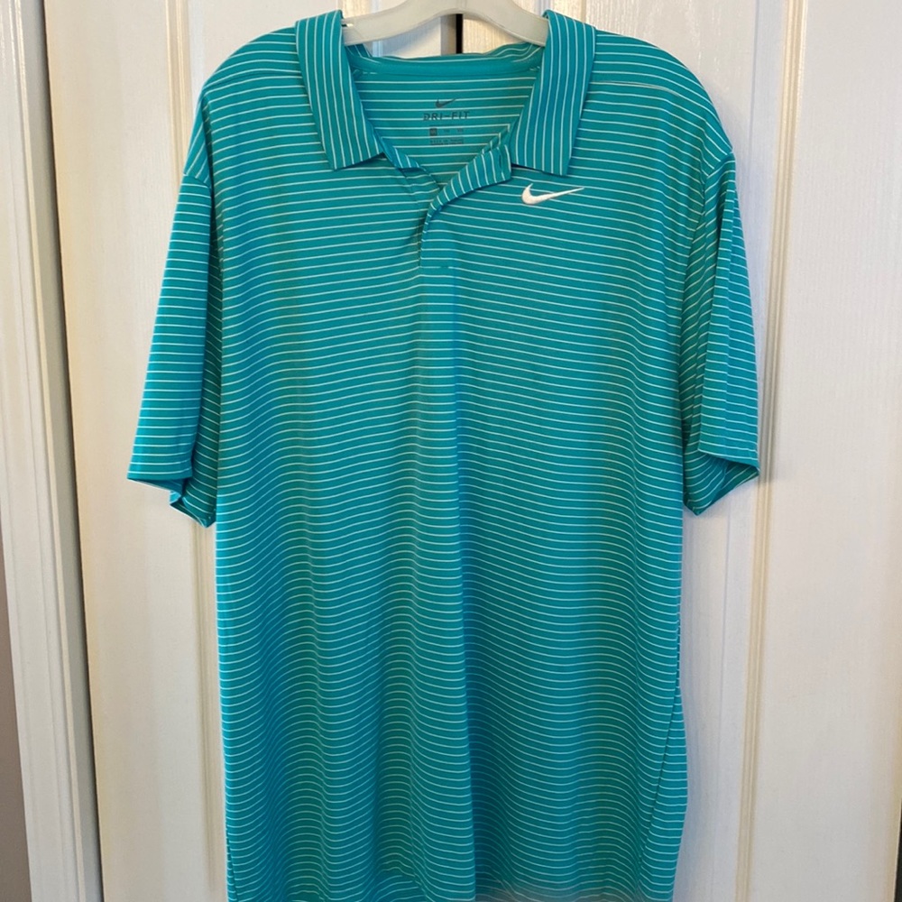 Nike polo, gently used. Worn a few times and has been away ever since.